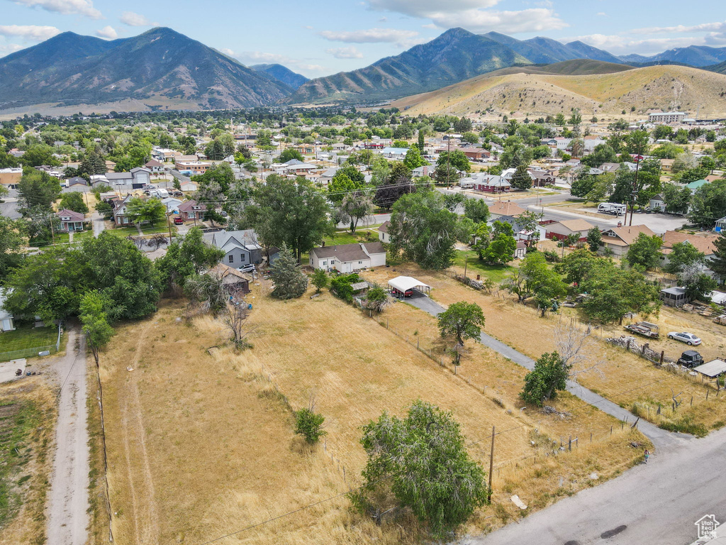Aerial view of residential area featuring a mountainous background