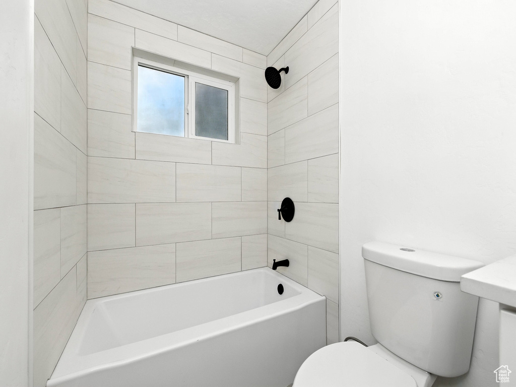 Bathroom with toilet and shower / bath combination