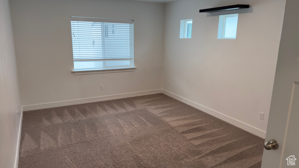 Empty room featuring carpet floors