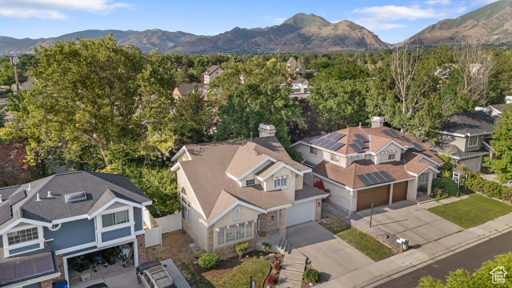 Aerial view of residential area featuring a mountain backdrop