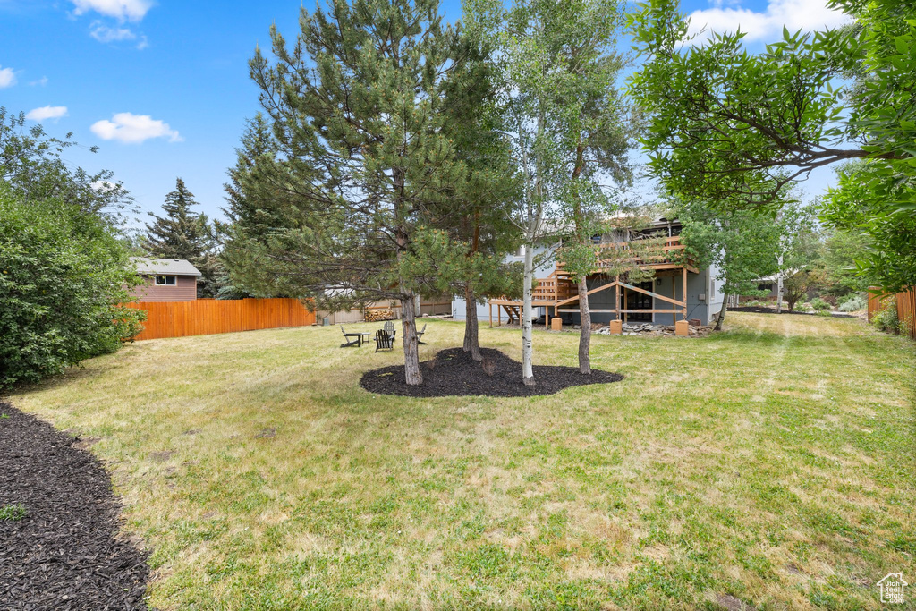 View of yard featuring stairway and a deck