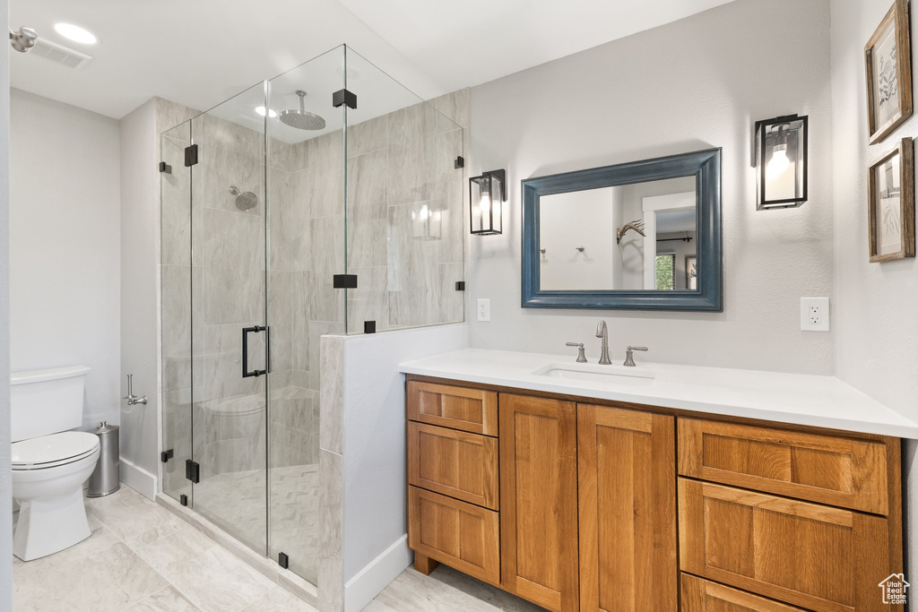 Bathroom with vanity and a shower stall