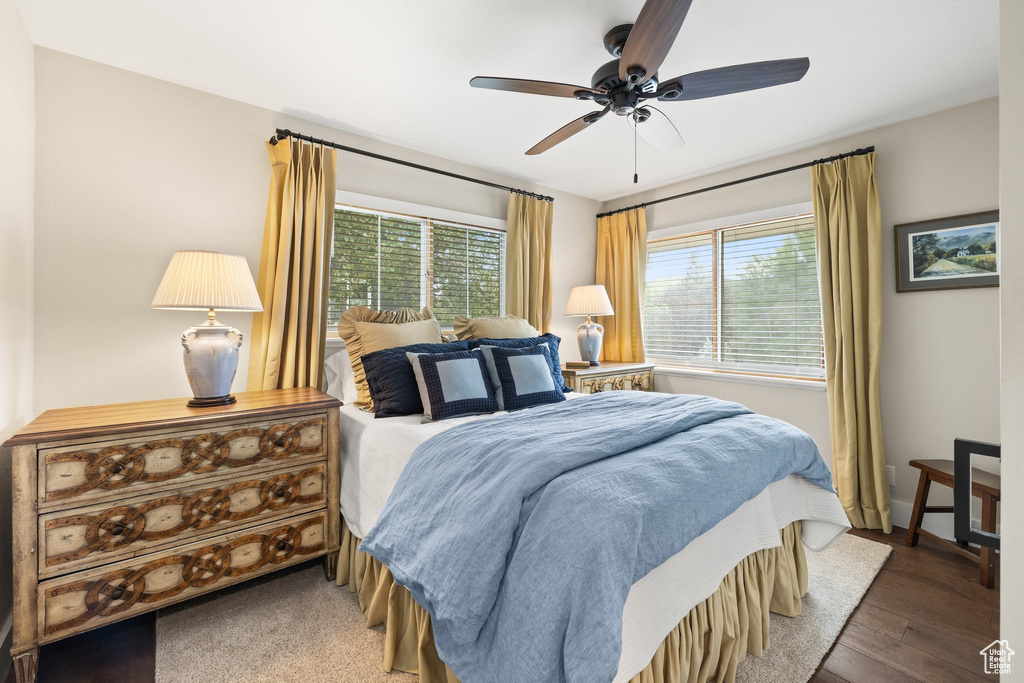 Bedroom with wood finished floors and ceiling fan