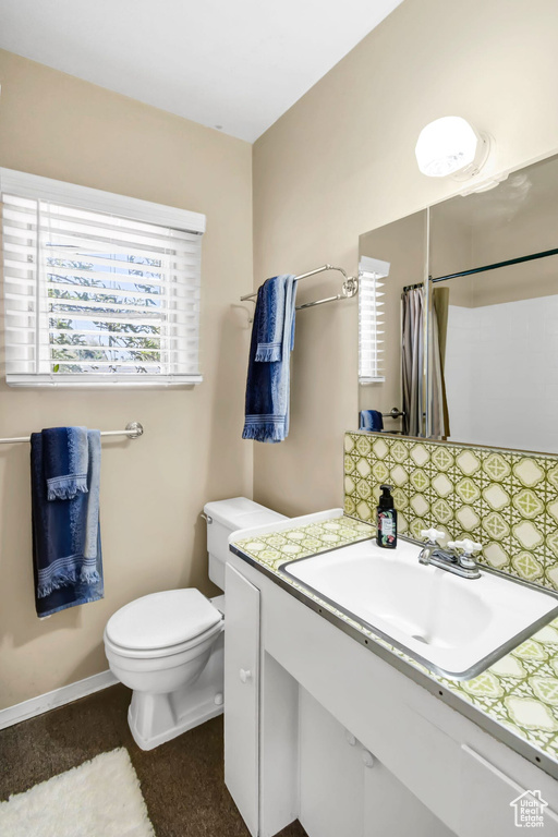 Full bathroom with vanity and a shower with shower curtain