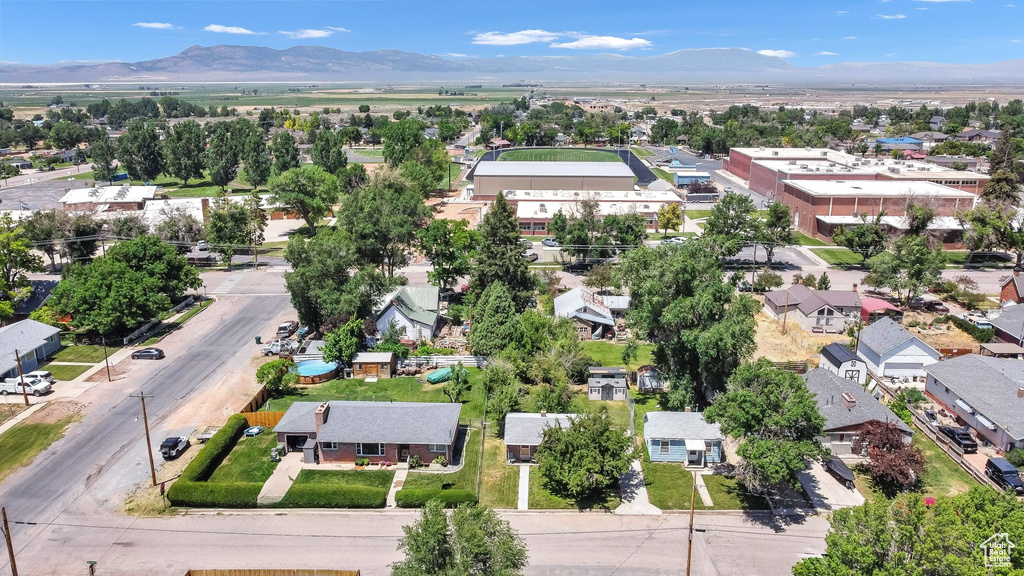 Aerial view of residential area featuring a mountain backdrop