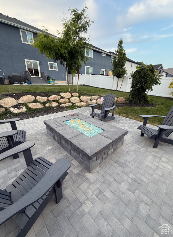 View of patio / terrace featuring an outdoor fire pit