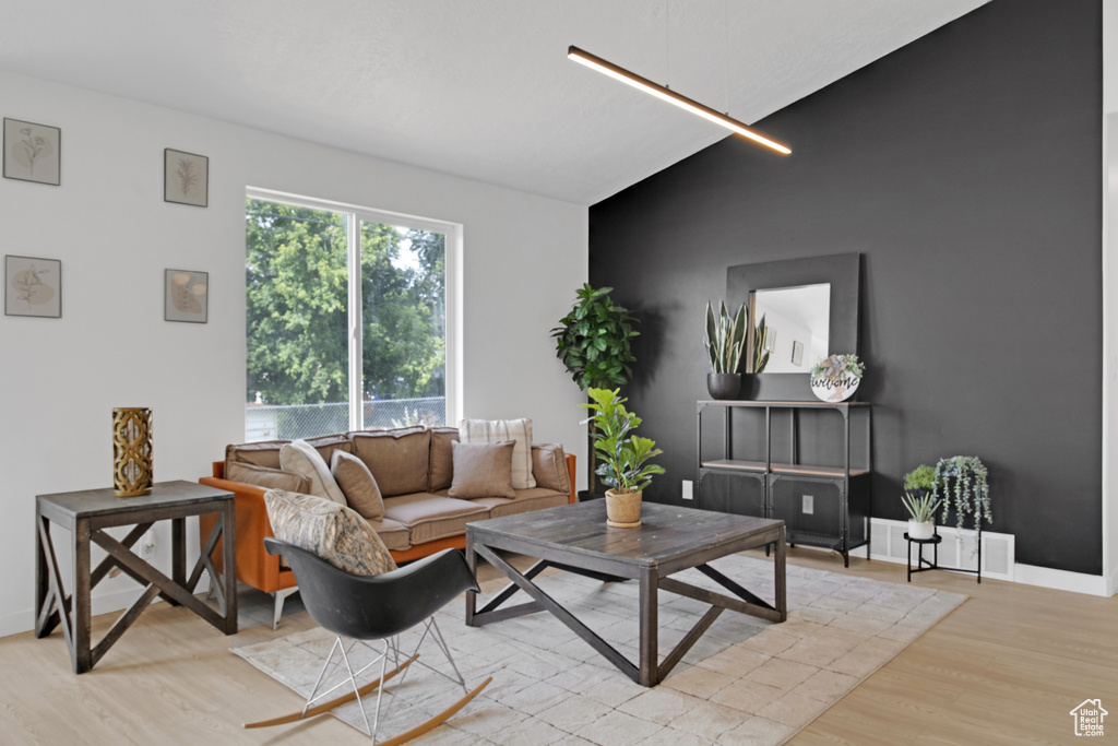 Living area featuring wood finished floors and baseboards