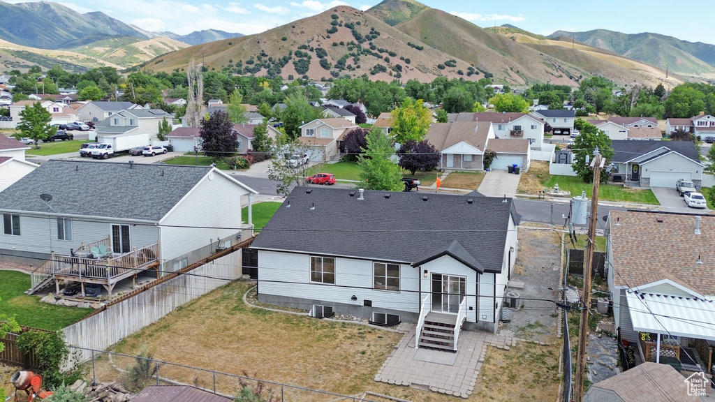 Aerial perspective of suburban area with a mountainous background