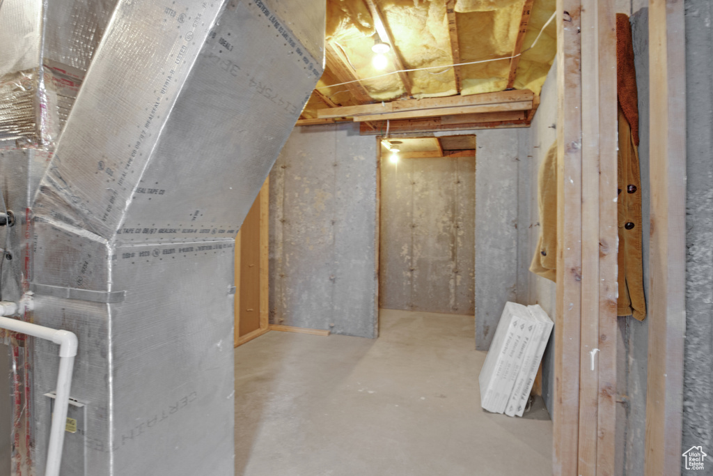 Unfinished below grade area with heating unit