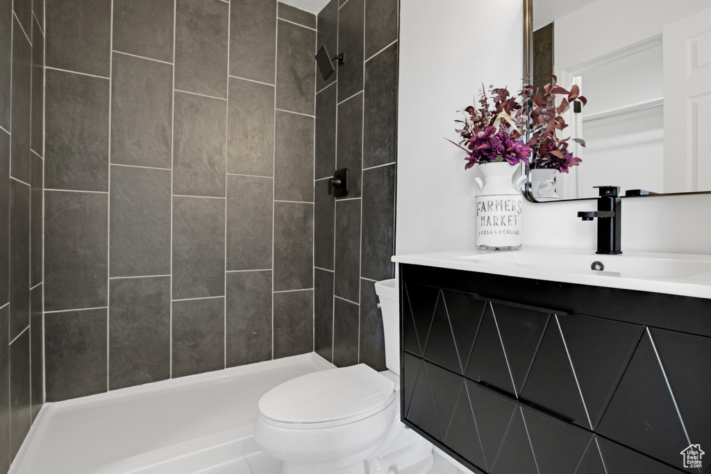 Full bathroom featuring vanity and a tile shower