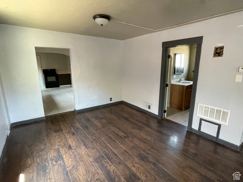 Spare room featuring hardwood / wood-style flooring
