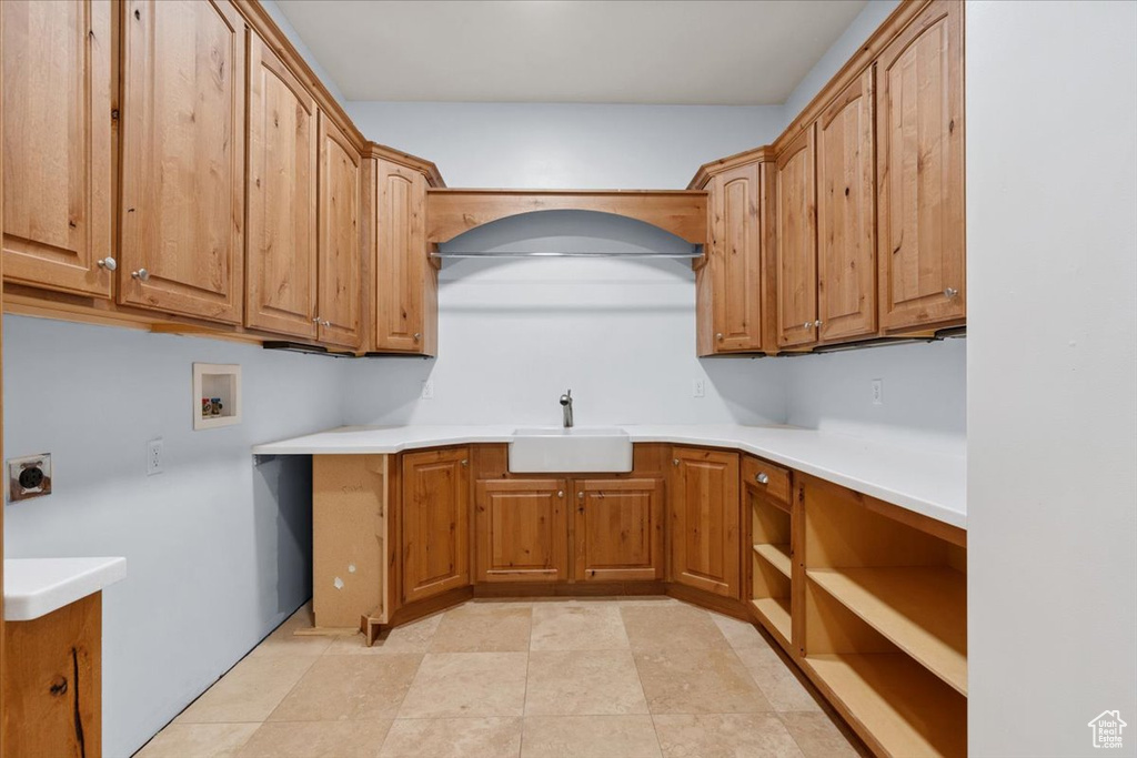 Laundry room featuring cabinet space, hookup for an electric dryer, and washer hookup