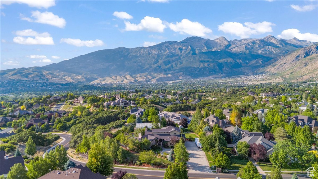 Aerial perspective of suburban area with a mountainous background