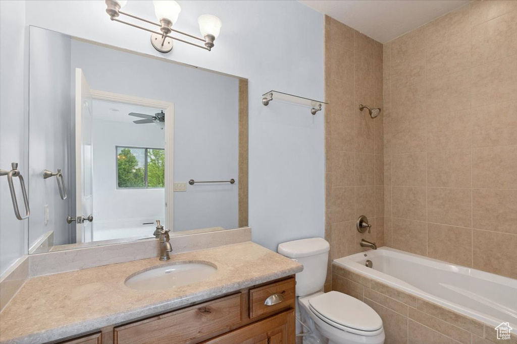 Full bathroom featuring vanity and tiled shower / bath combo