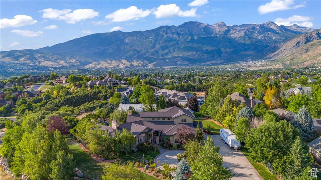 Aerial perspective of suburban area with a mountainous background
