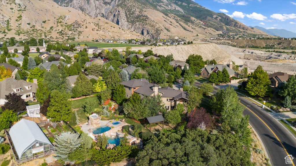 View of property location with a mountainous background and nearby suburban area