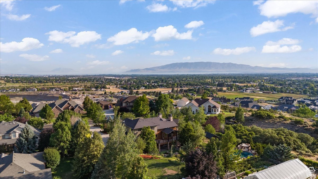 Aerial view of residential area featuring a mountain backdrop