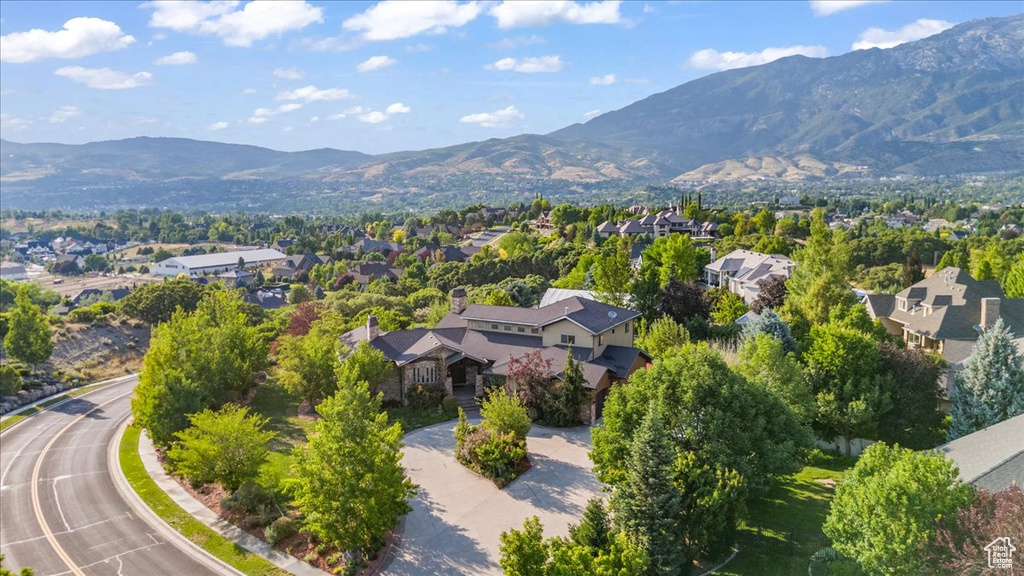 Aerial perspective of suburban area featuring a mountain backdrop