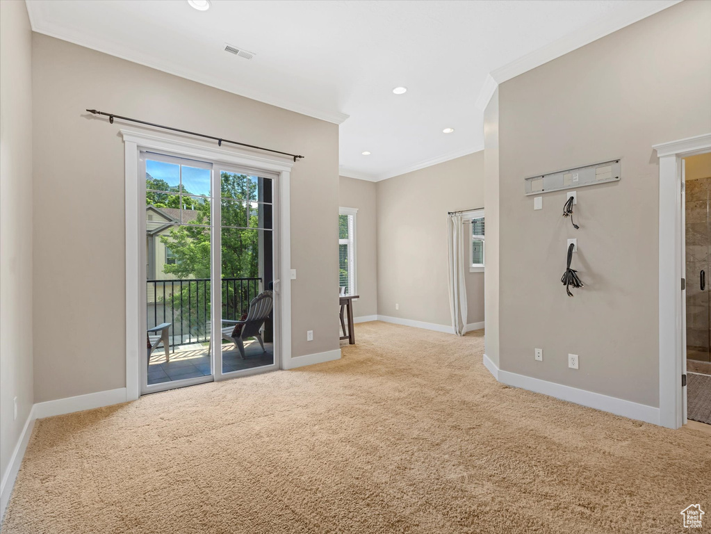 Unfurnished room with carpet flooring, crown molding, and recessed lighting