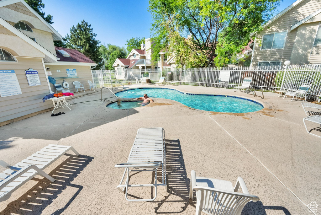 Community pool with a patio area