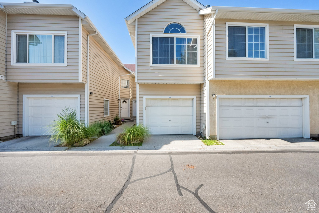 View of property with a garage
