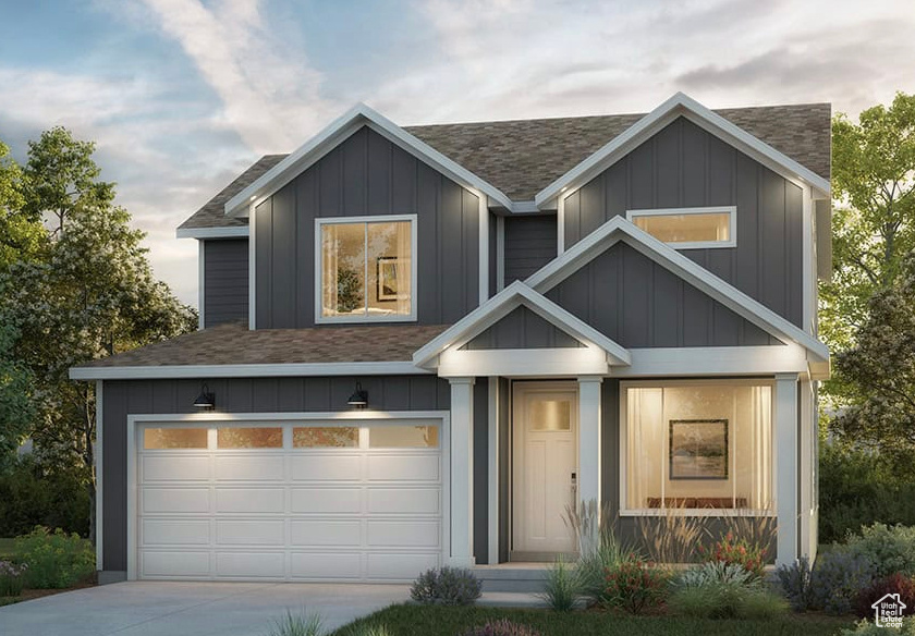 View of front of house featuring roof with shingles, concrete driveway, an attached garage, and board and batten siding