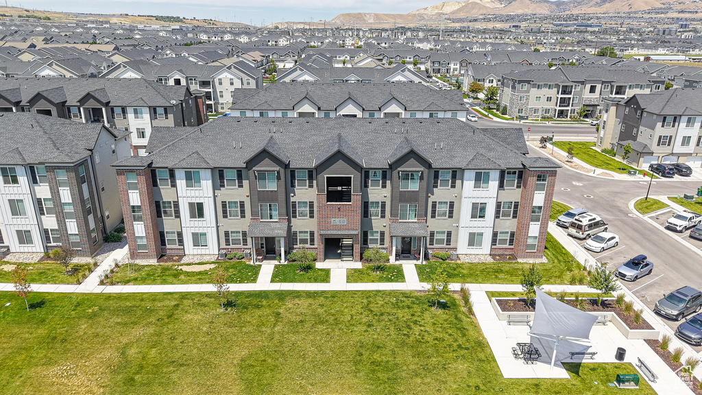 Aerial perspective of suburban area with a mountainous background