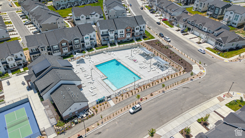 Aerial perspective of suburban area featuring a pool area