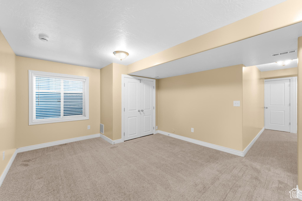 Below grade area featuring carpet flooring