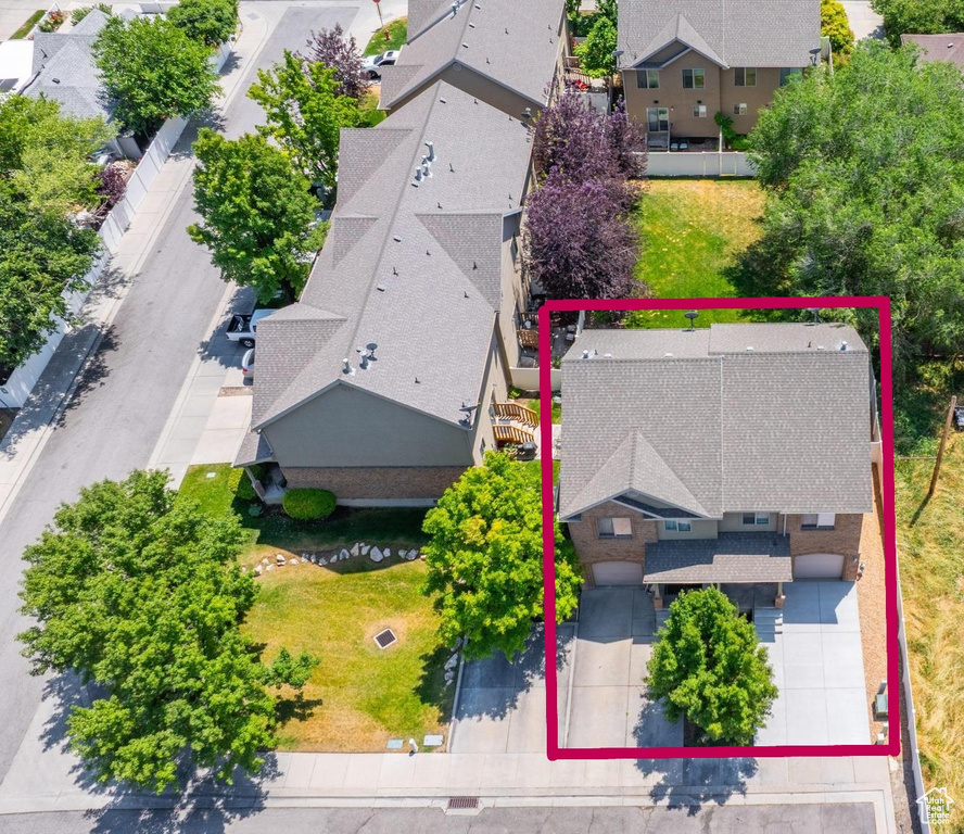 Aerial perspective of suburban area with property parcel outlined