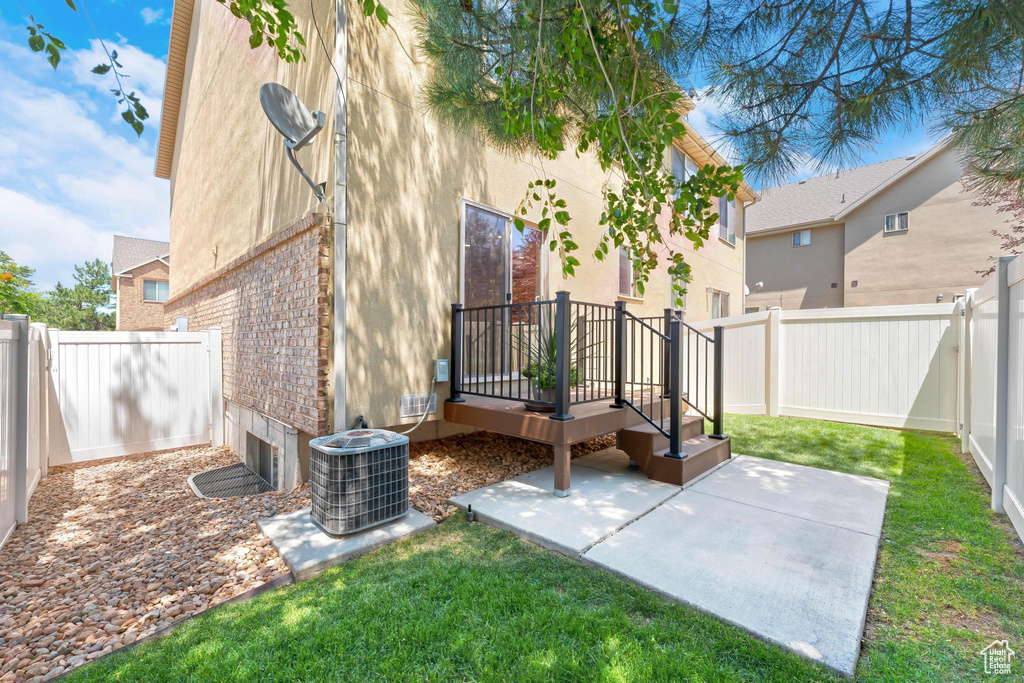 Fenced backyard with a patio