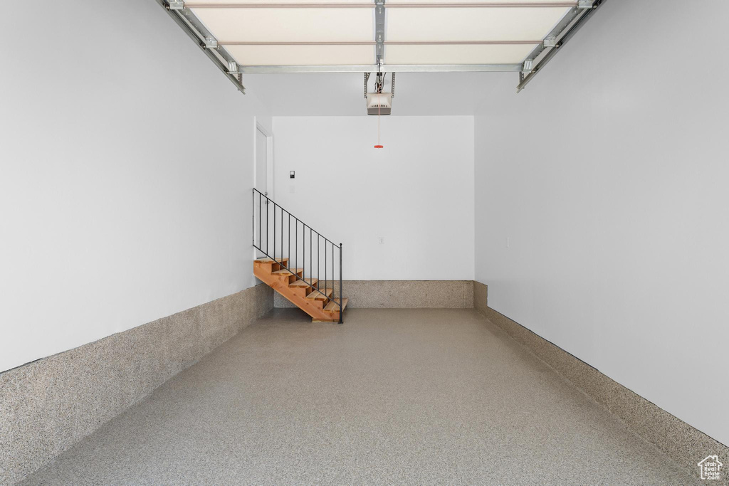 Garage featuring a garage door opener