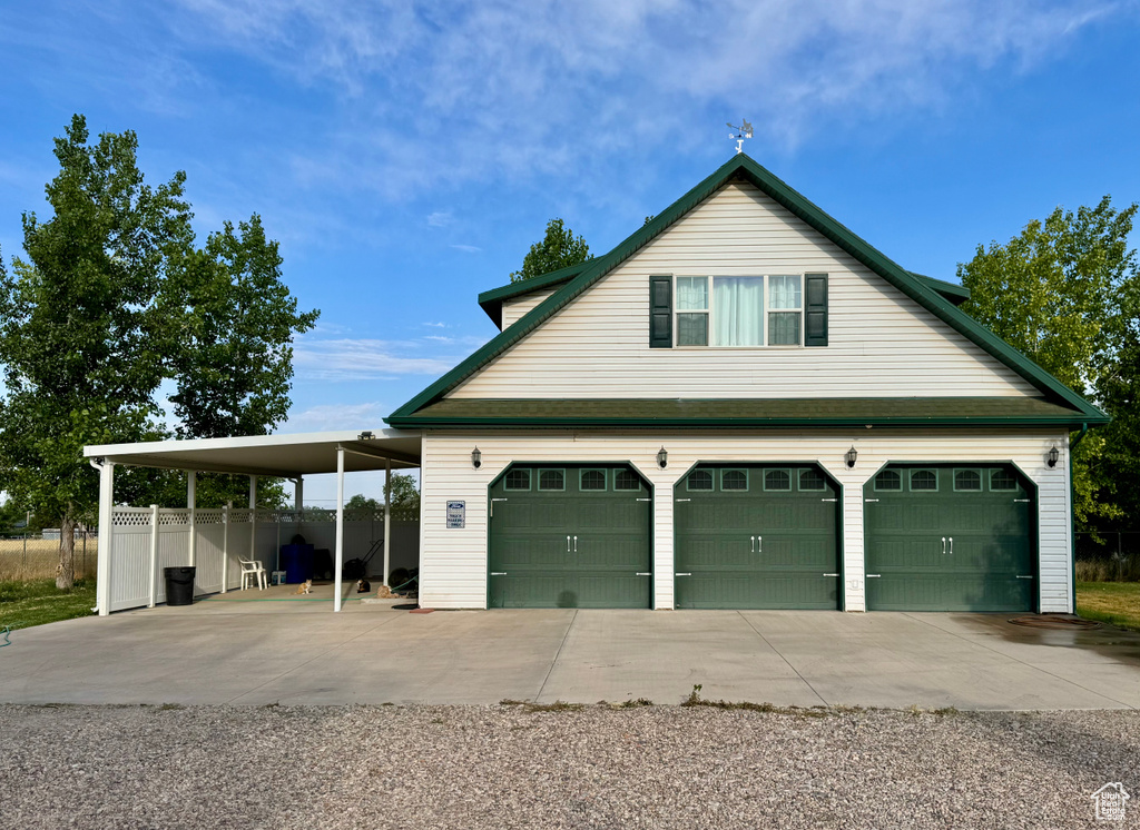 Garage featuring driveway