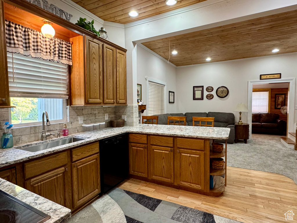 Kitchen with wooden ceiling, black dishwasher, a peninsula, recessed lighting, and light stone counters