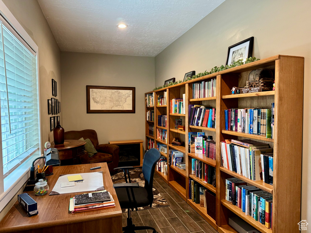 Office featuring dark wood-style flooring, a textured ceiling, and recessed lighting