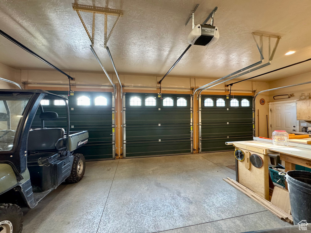 Garage featuring a garage door opener