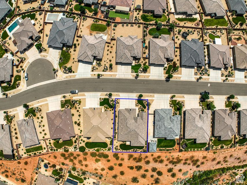 Aerial perspective of suburban area featuring property parcel outlined