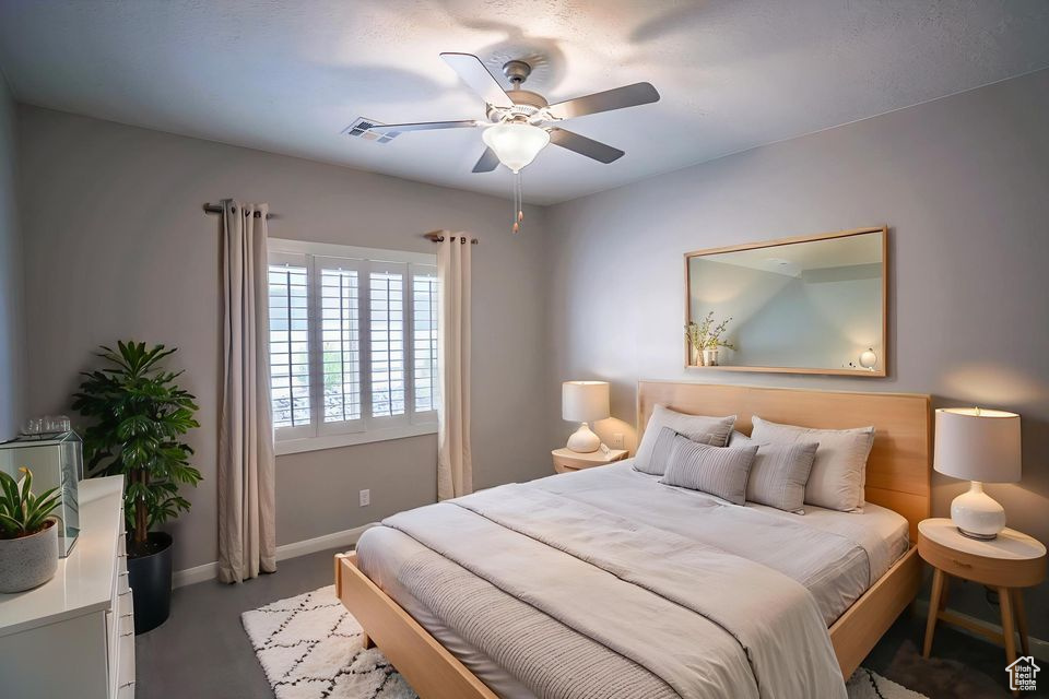 Bedroom featuring baseboards and ceiling fan