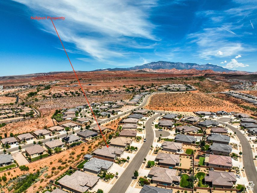 Aerial perspective of suburban area with a mountain backdrop