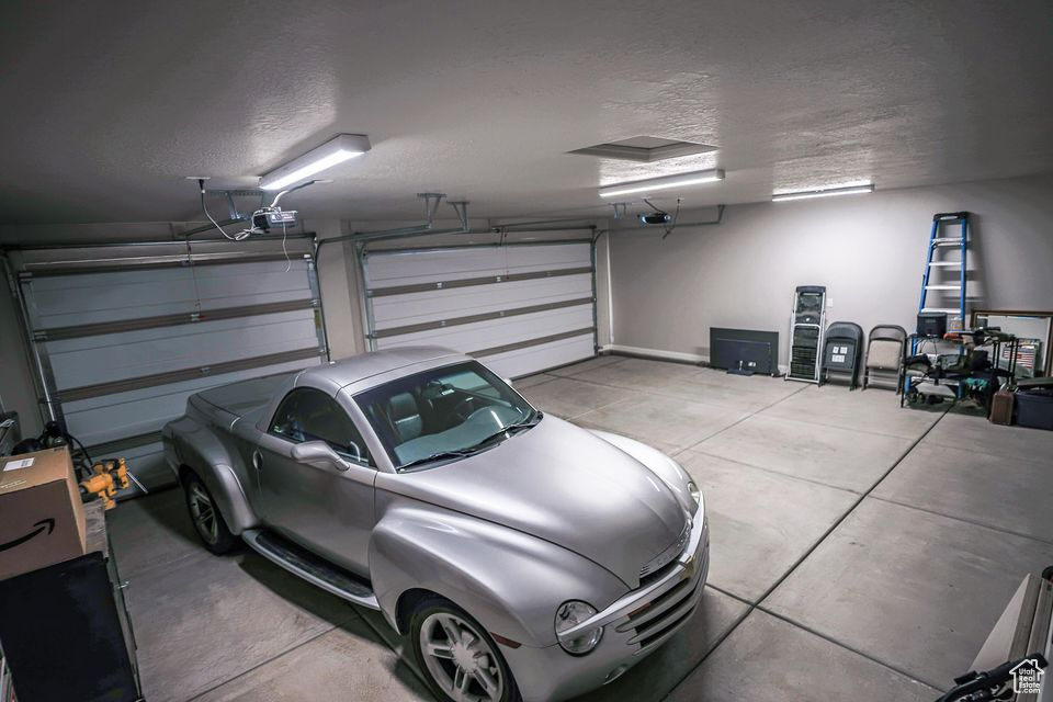 Garage featuring a garage door opener