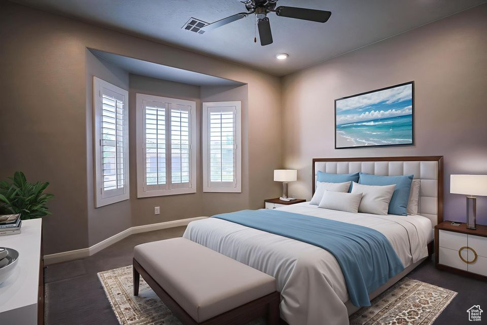 Bedroom featuring baseboards and a ceiling fan
