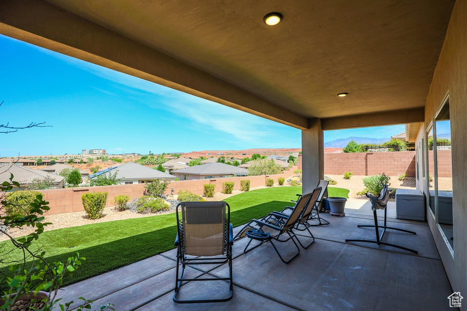 Fenced backyard with a patio and a mountain view