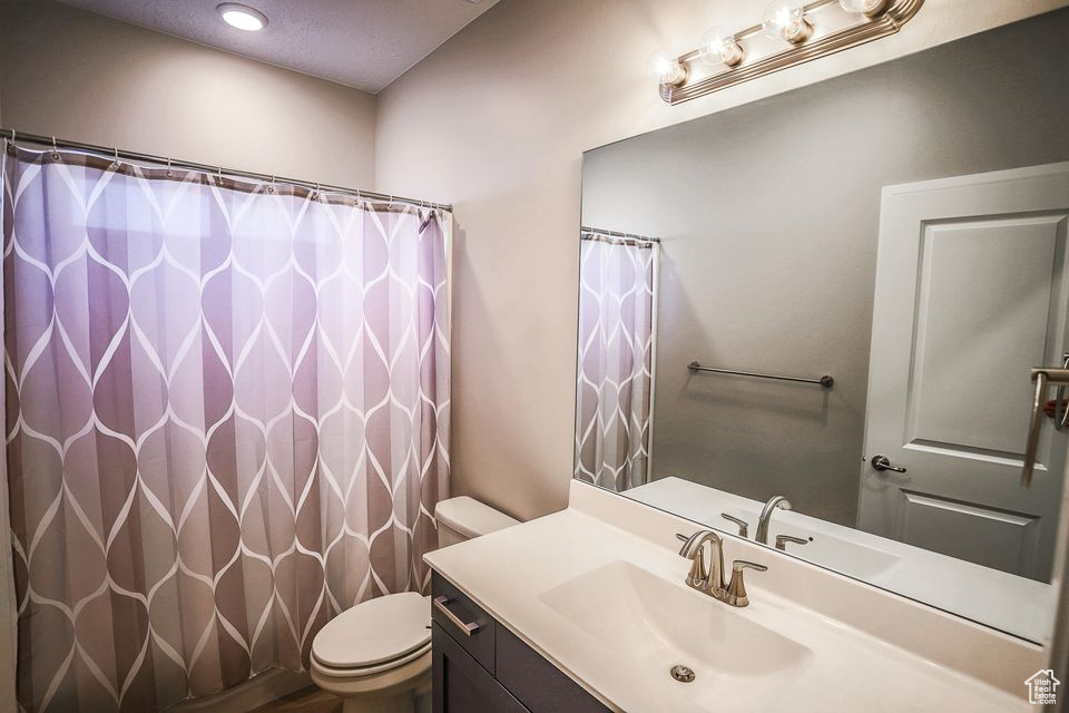 Bathroom with vanity and a shower with curtain