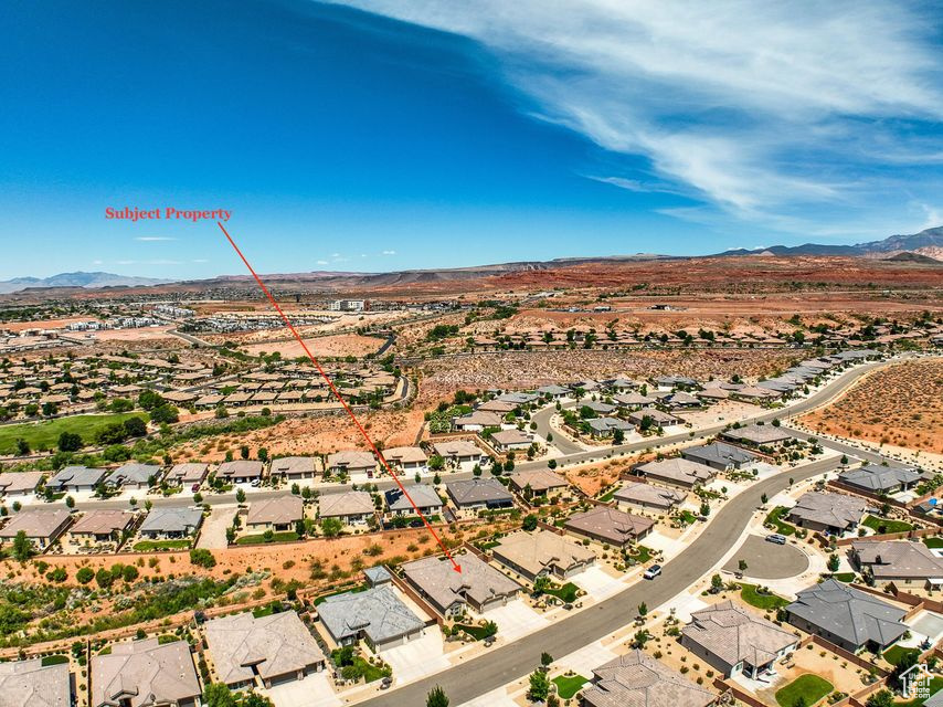 Aerial perspective of suburban area featuring a mountainous background