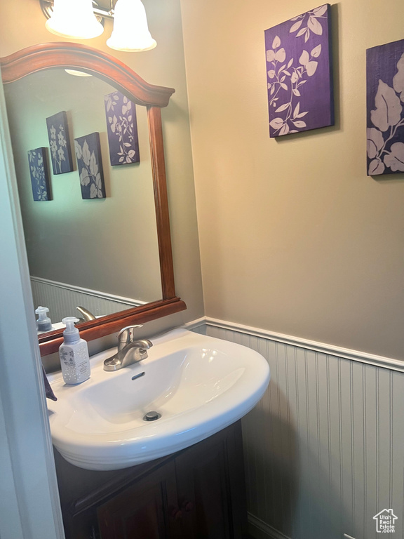 Bathroom with wainscoting and vanity