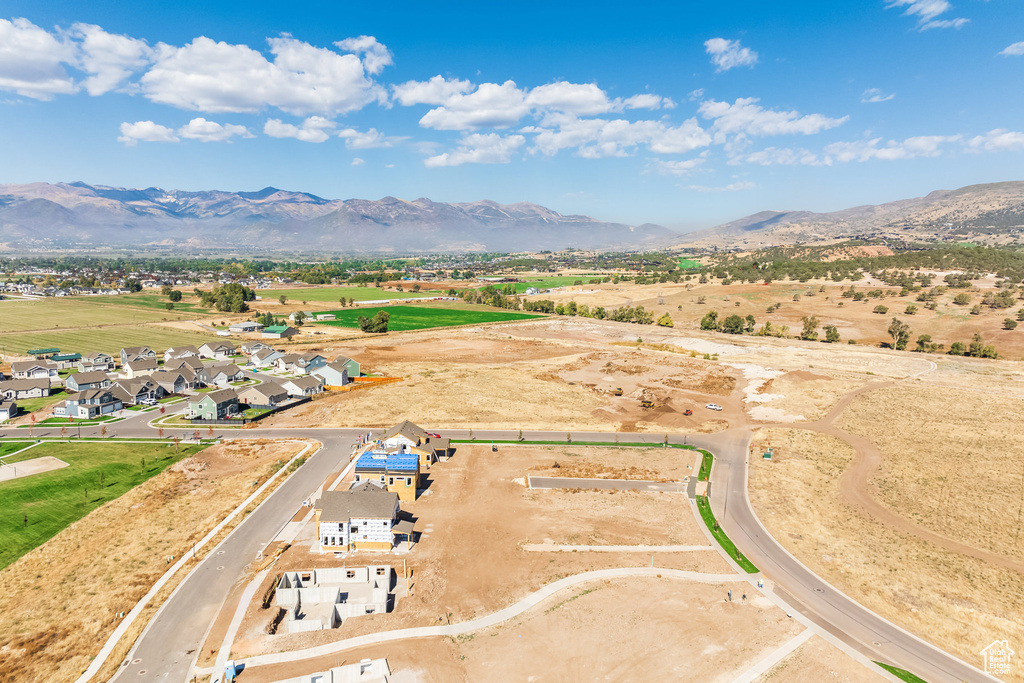 Aerial view of residential area featuring mountains