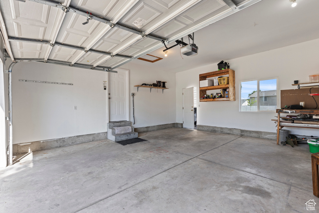Garage featuring a garage door opener