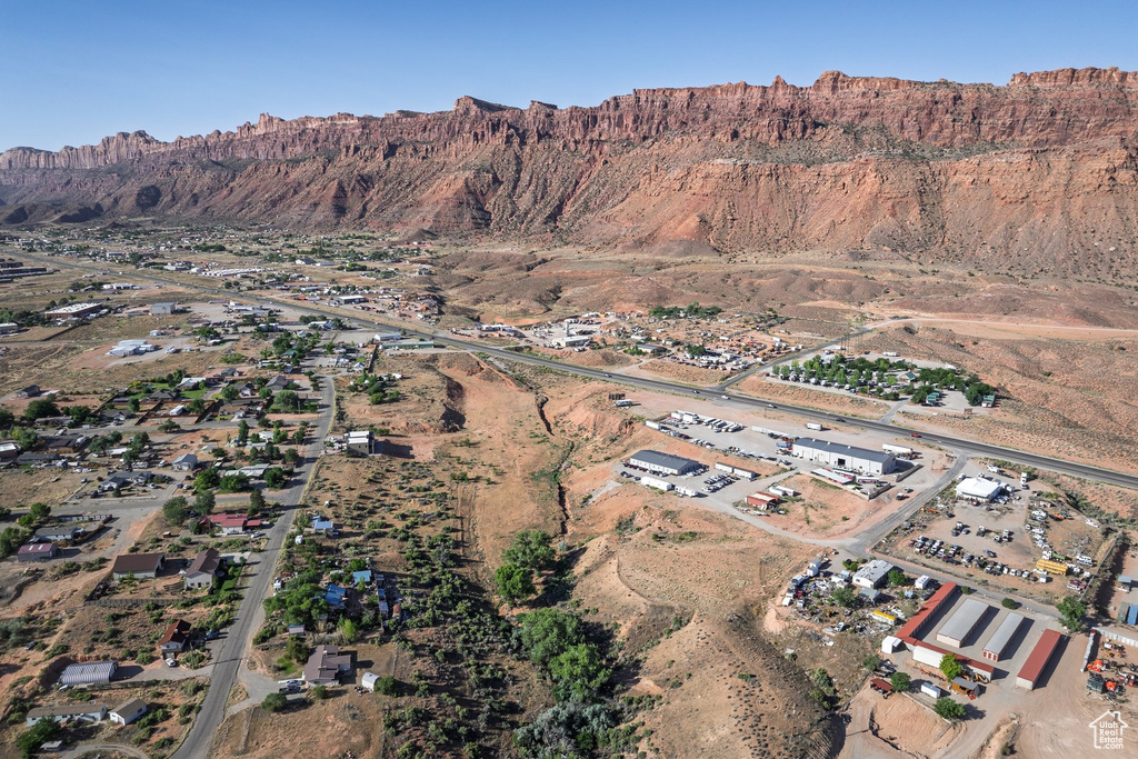 Aerial view of property's location with a mountainous background
