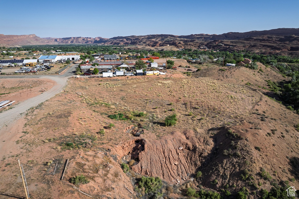 Aerial overview of property's location with a mountainous background