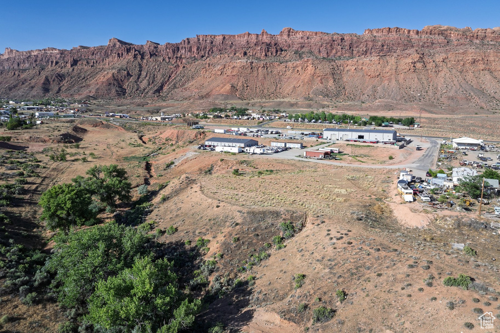 Aerial overview of property's location with a mountain backdrop